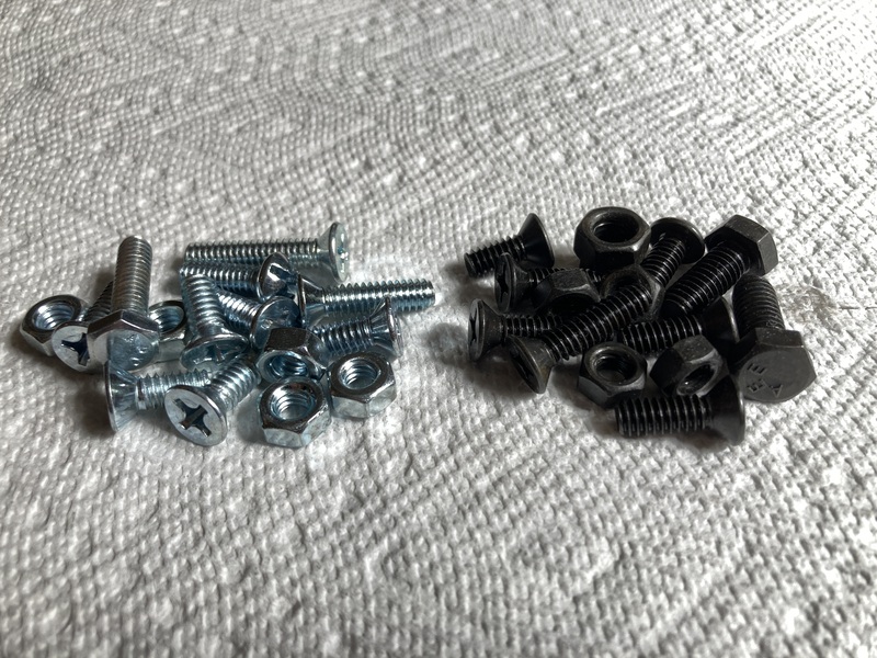 Photo of blued hardware compared to the originals