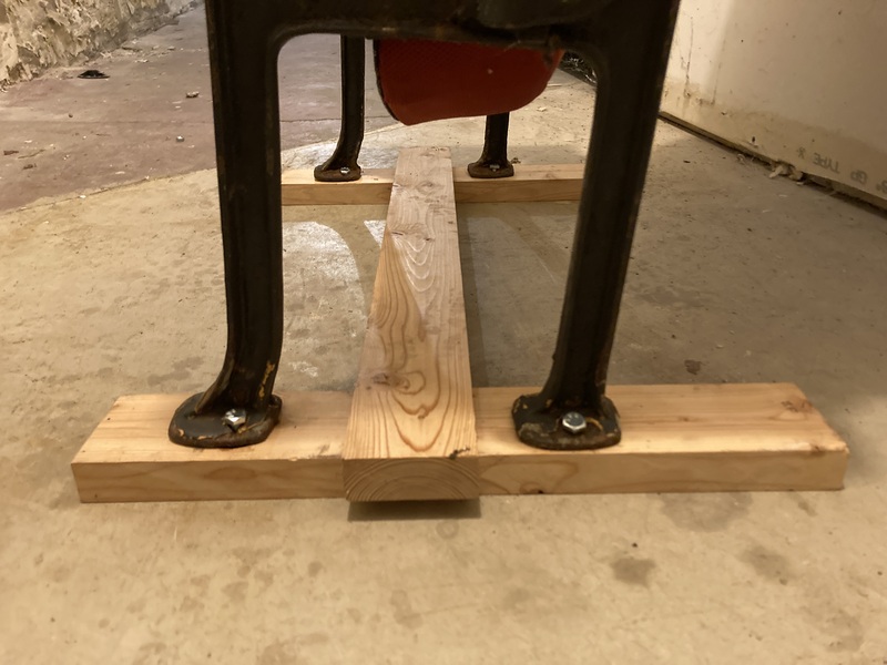 Photo of the crossbar being fitted to the chair