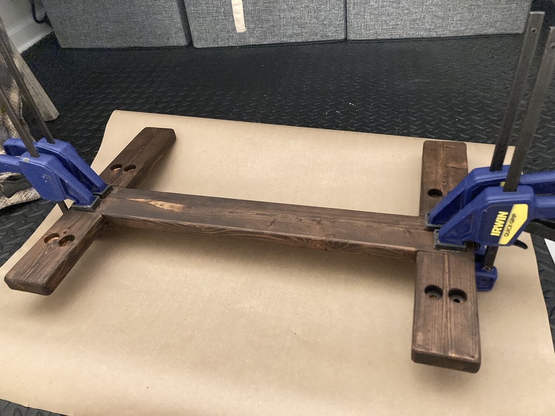 Photo of the stained and glued base in clamps
