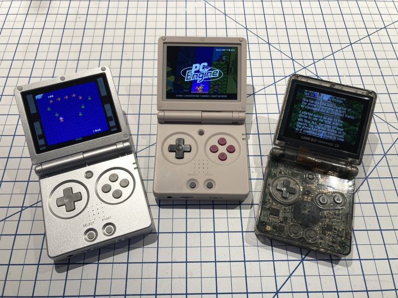 Two RG35XXSP’s next to a modded GBA SP