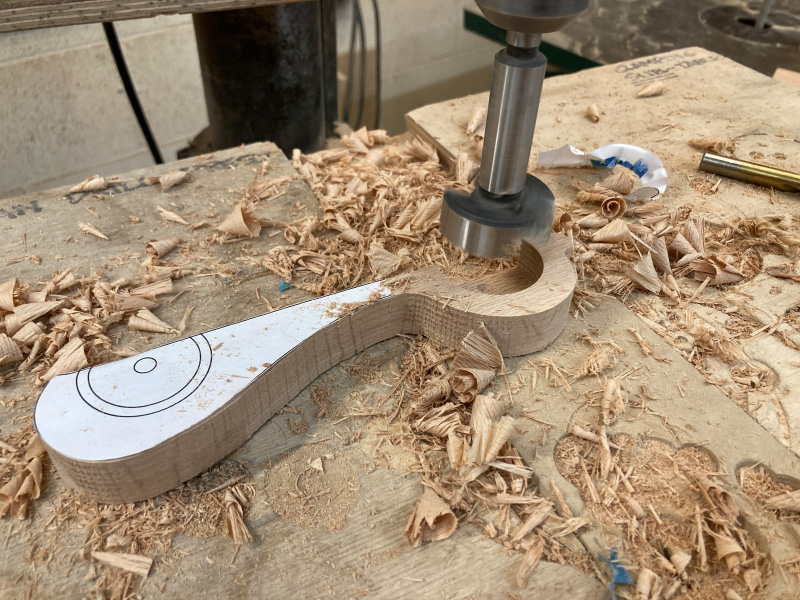 Photo of a drill press making a wheel well