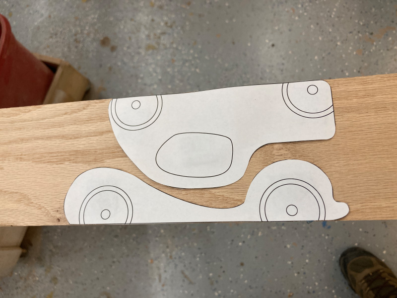 Photo of cut-out pattern taped to wood board